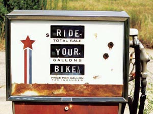 Old gas pump reading "ride your bike"