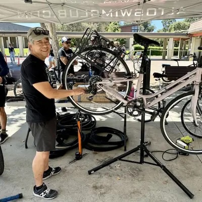 Shop Manager, Gregg, repairing a bike