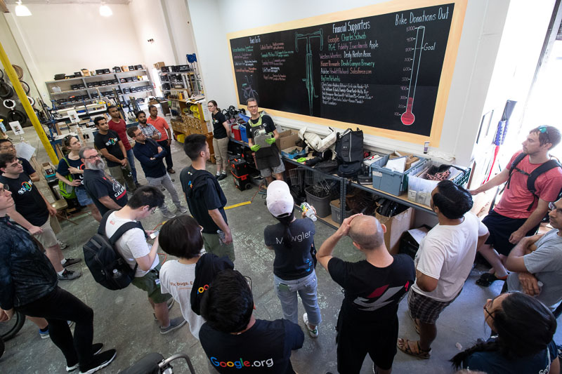 Dave Fork gives and orientation to fellow Google employees at a Google Serve Day at Silicon Valley Bicycle Exchange. 6/12/2019. photo: Andrew Yee